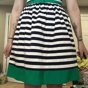 Navy blue and white striped dress with green detailing